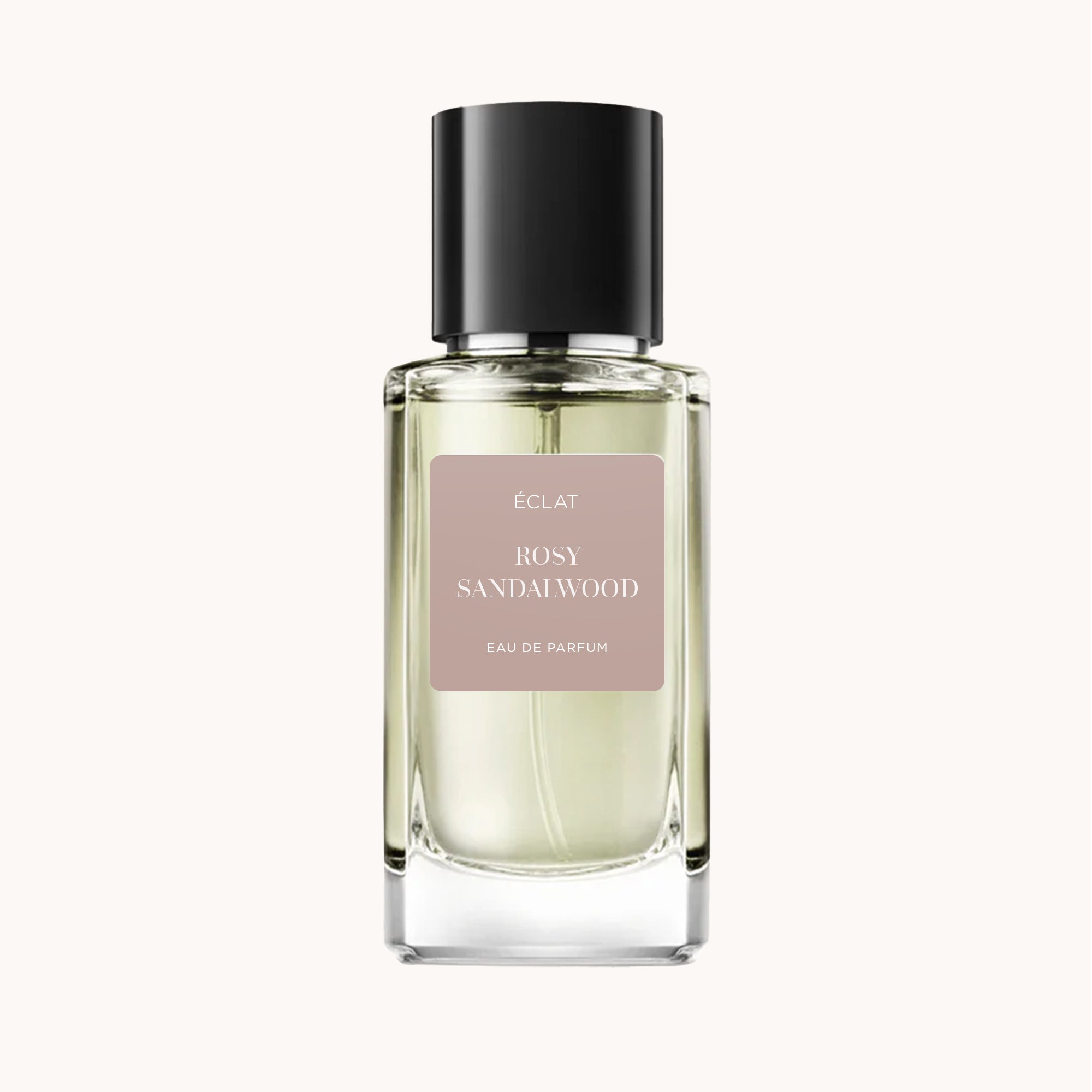 ÉCLAT Rosy Sandalwood VIP dans un flacon en verre facetté avec un bouchon noir mat et une étiquette rose pâle.