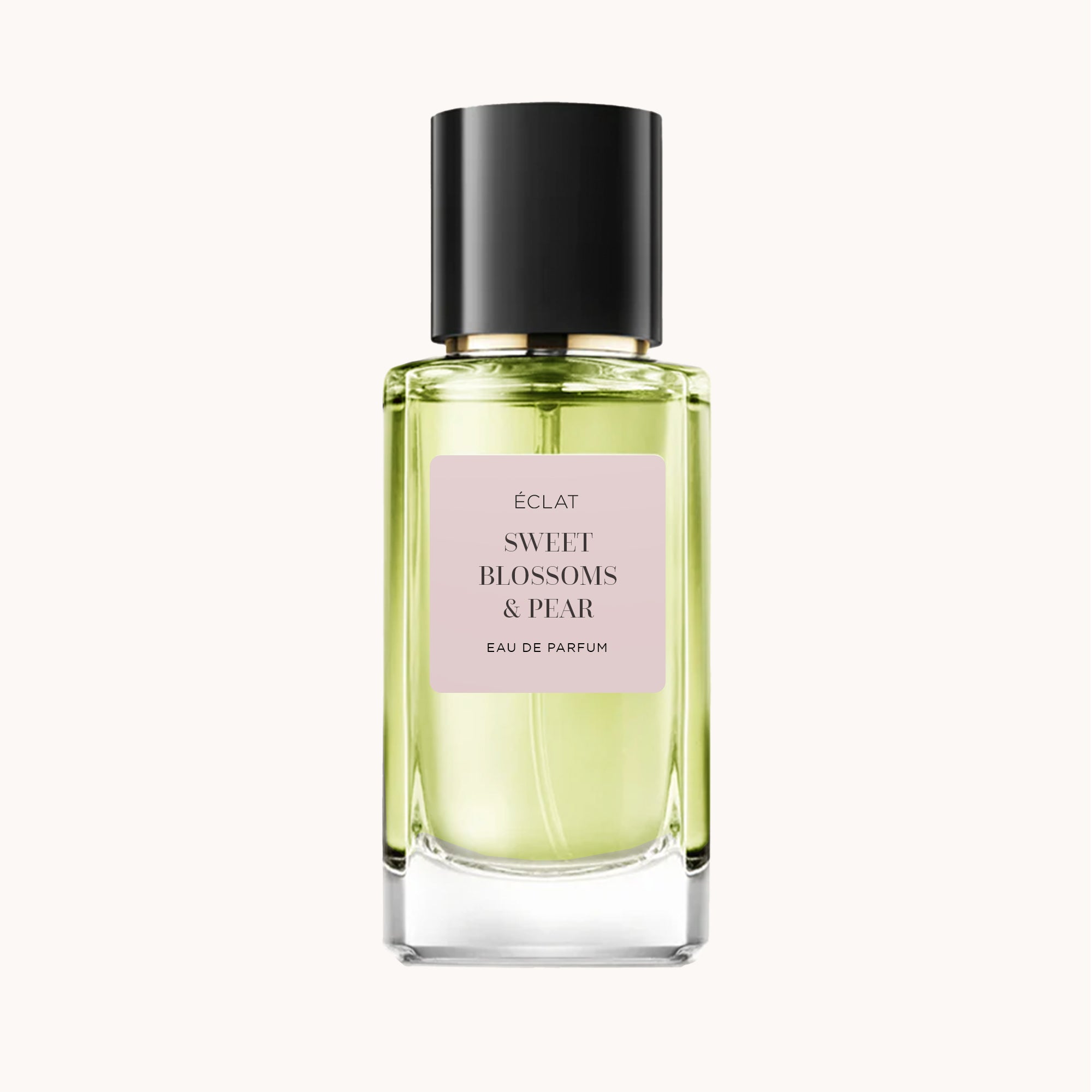 Flacon en verre facetté avec étiquette rose pâle et bouchon noir pour ÉCLAT Sweet Blossoms & Pear.