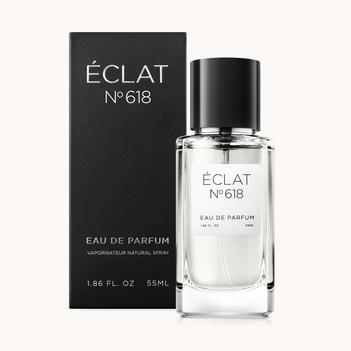 Glass flacon with a black cap next to a matte black box, both labeled ÉCLAT Sweet Spicy Tagetes.