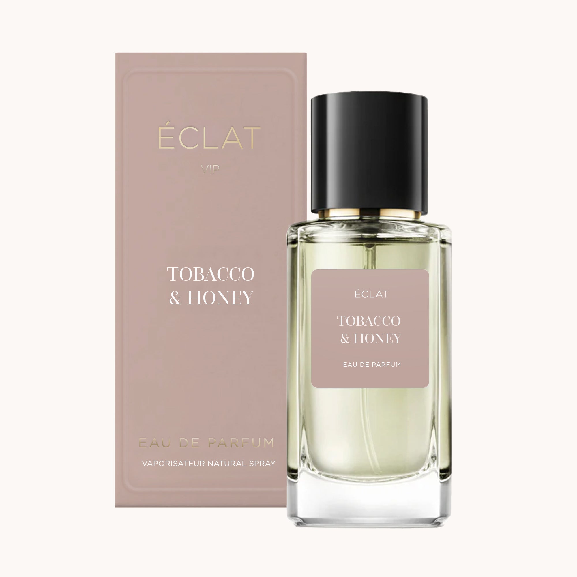 Glass bottle of ÉCLAT Tobacco & Honey with black cap, beside a beige box with brand and product name.