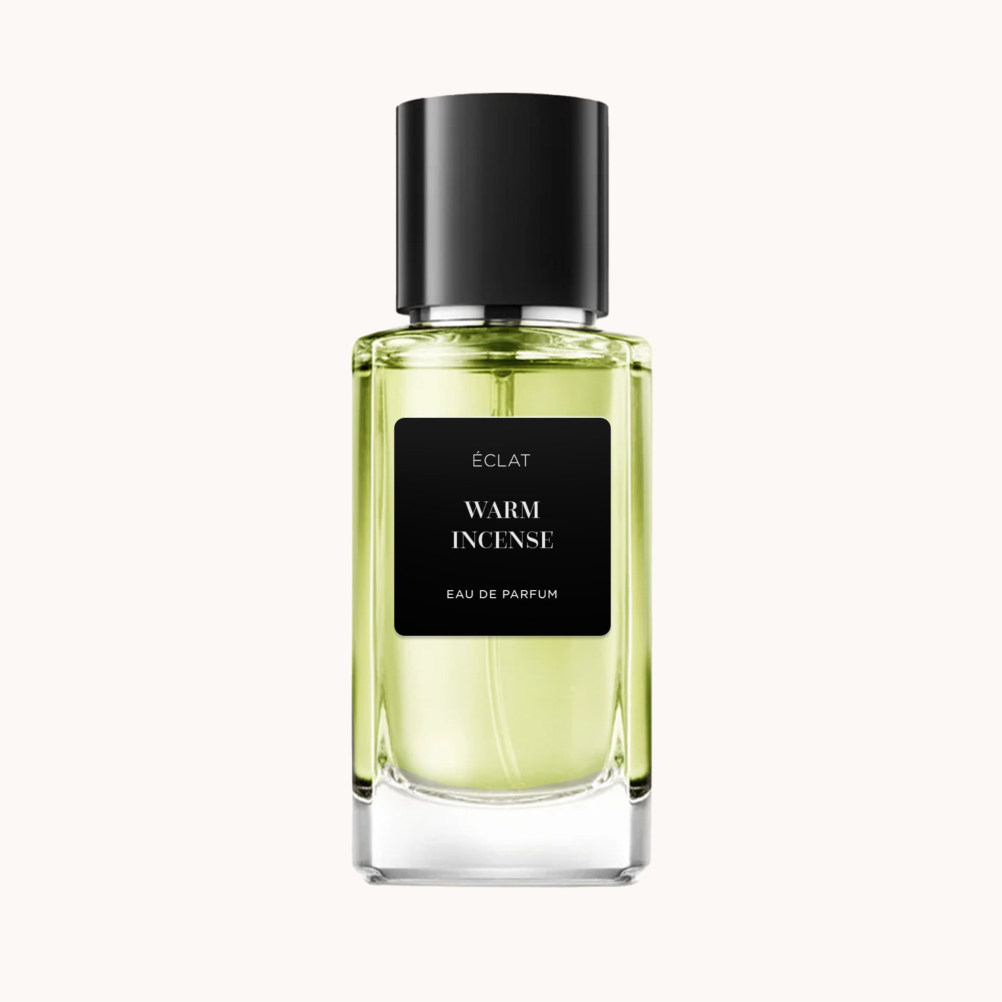 Frasco de vidro facetado com rótulo e tampa pretos, exibe ÉCLAT Warm Incense Eau de Parfum.