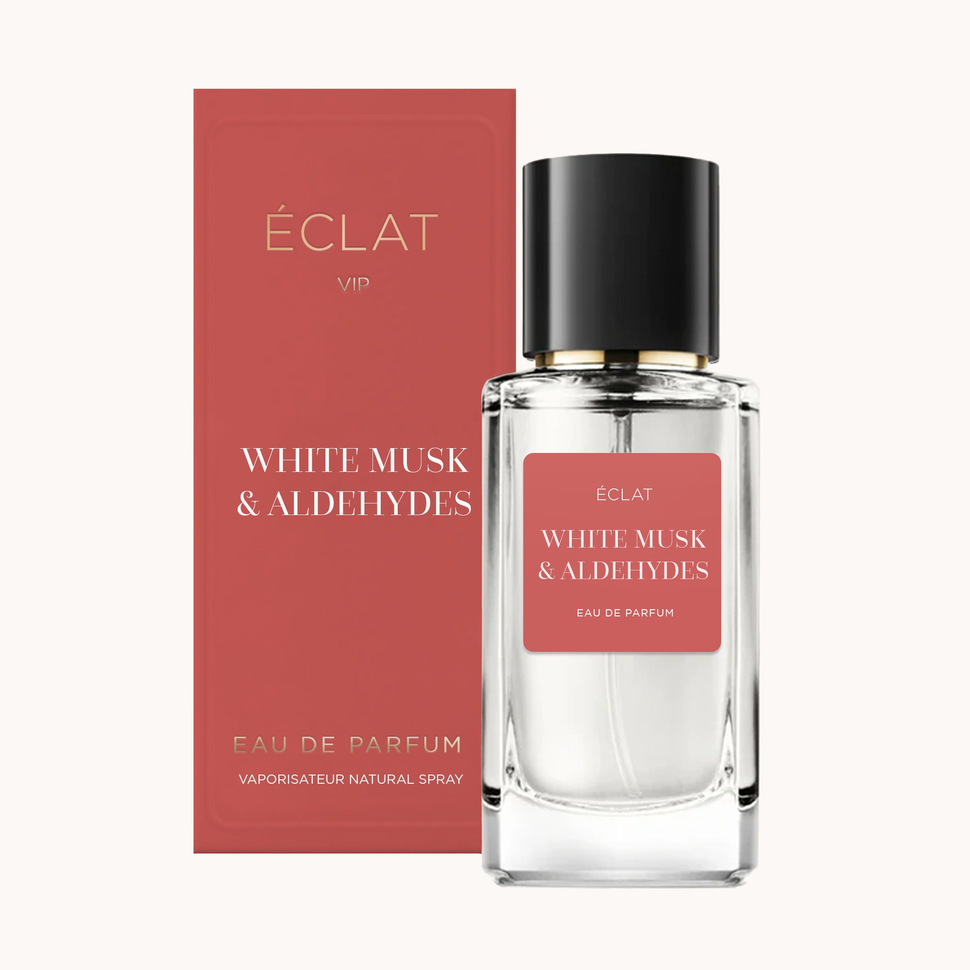 Elegant glass bottle of ÉCLAT White Musk & Aldehydes with a black cap, next to a red box with gold accents.